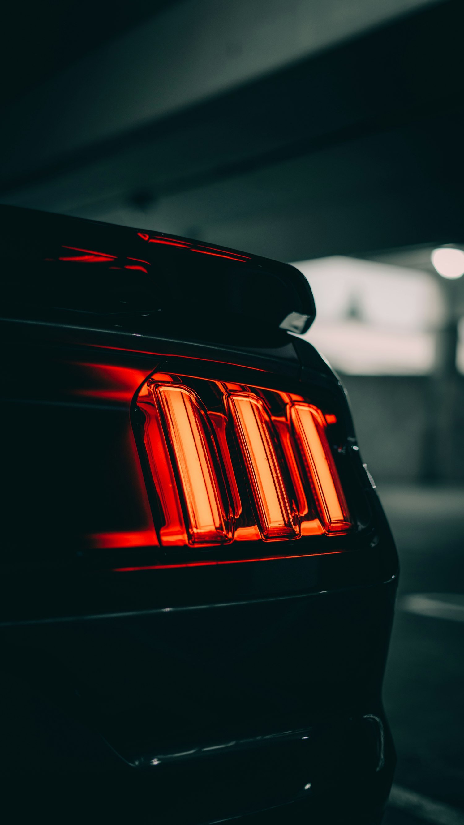 Deep, mirror-like ceramic-coated paintwork on a dark car